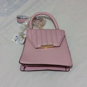 Blush kiss handbags size small color pink.